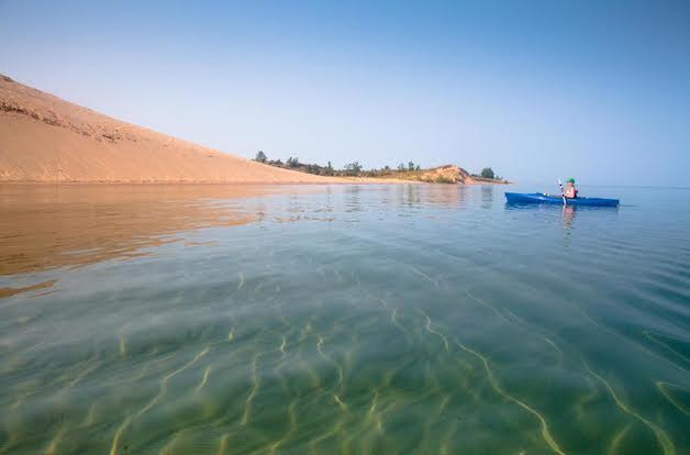 We're lucky to have more than our share of summer moments in Traverse City, but paddling along the shoreline of Sleeping Bear Dunes National Lakeshore on a perfect August morning was pretty special. - Nick