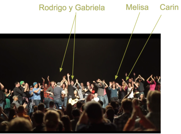Carin and Melisa on stage at a Rodrigo y Gabriela concert